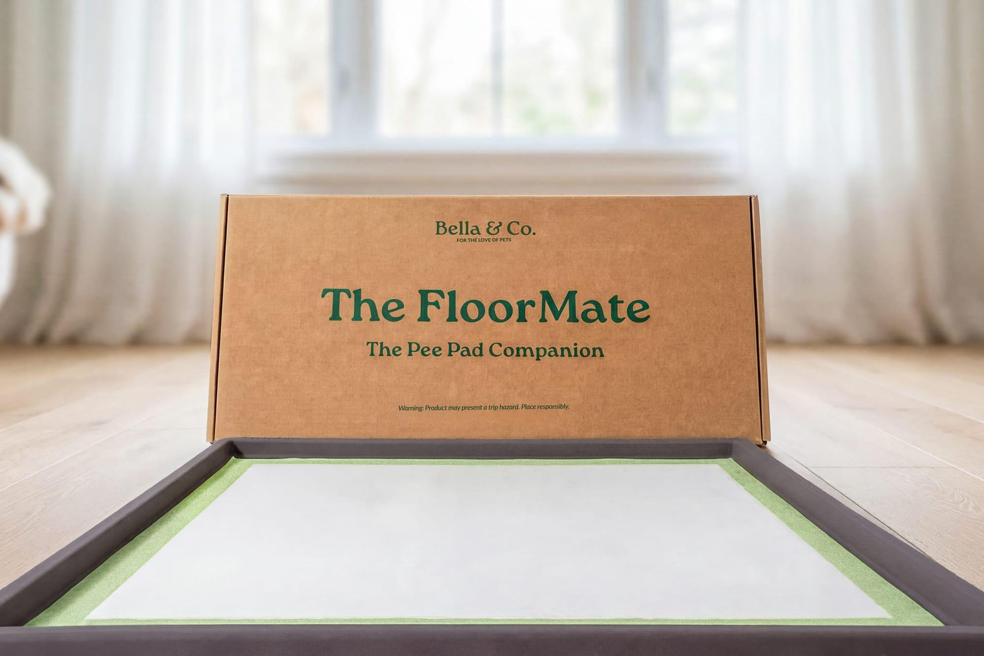 A Pee Pad and FloorMate station on patterned tile, no rinsing tray required